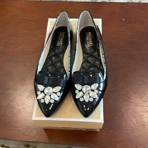 MK black flat size 7 new
